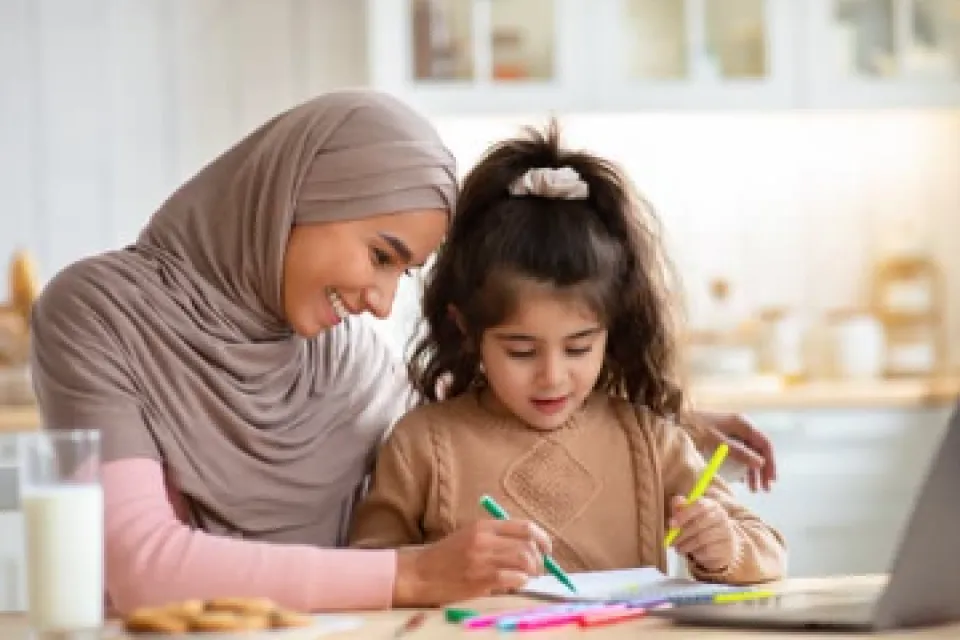Mom and daughter working on homework