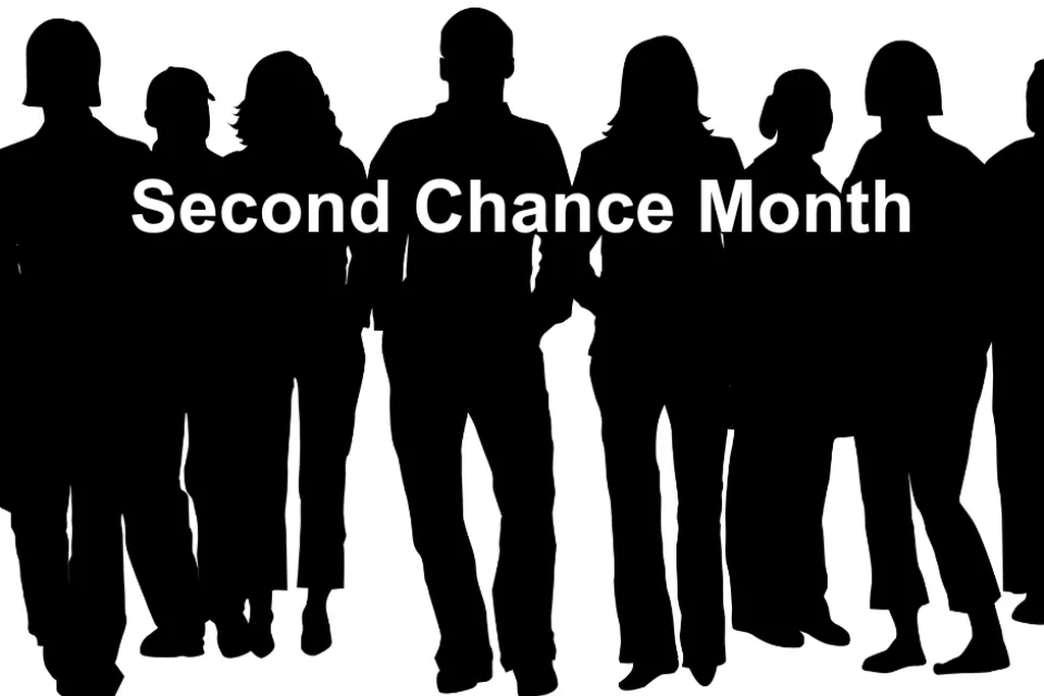 A silhouette of people with the words, "Second Chance Month," over them.