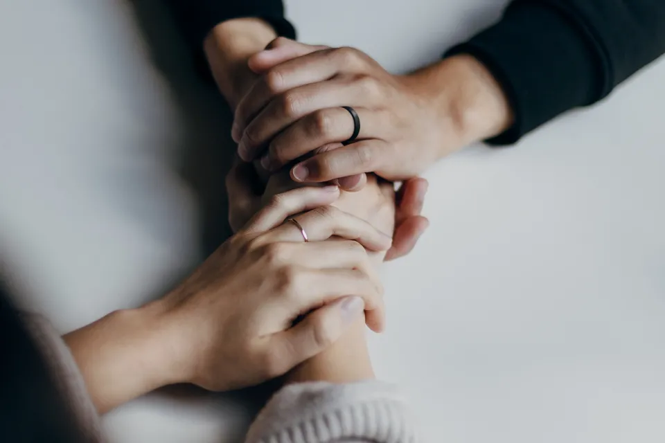 two people holding hands