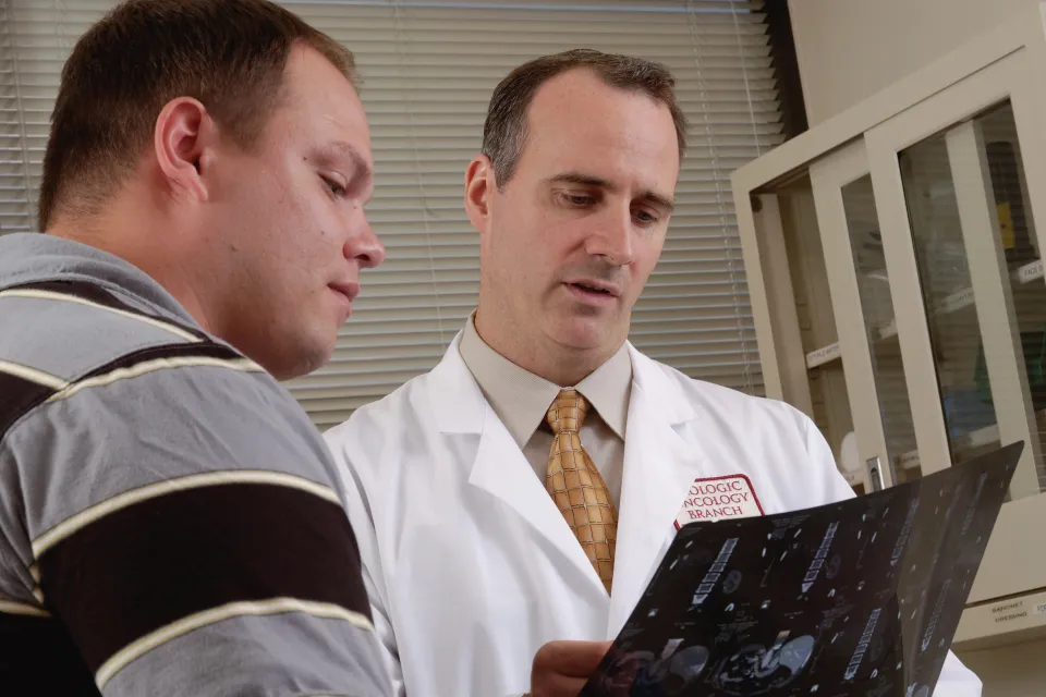 a doctor showing something to a patient