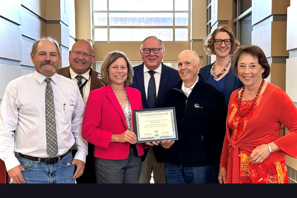 Board of Commissioners with achievement award
