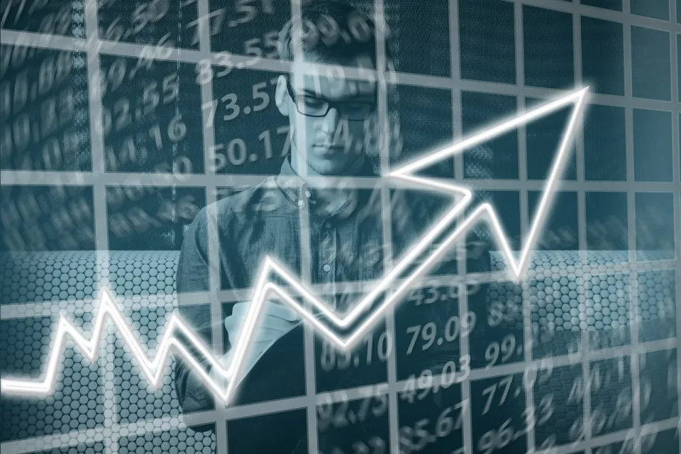 Man with stock numbers and and arrow heading upwards