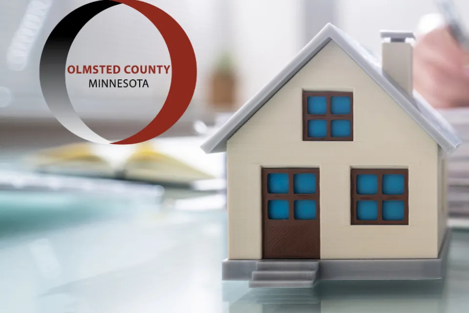 Olmsted county logo. A model of a house.