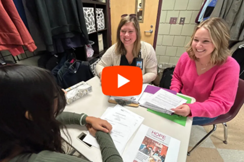 Image from the 2023 Year in Review video with play button