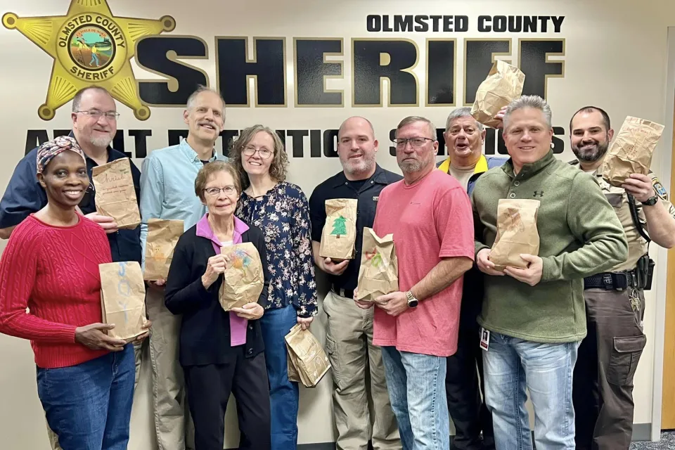 Group Photo of Adult Detention Center Staff and members of Rochester Seventh-day Adventist Church before delivering goodies bags to detainees and staff for Christmas