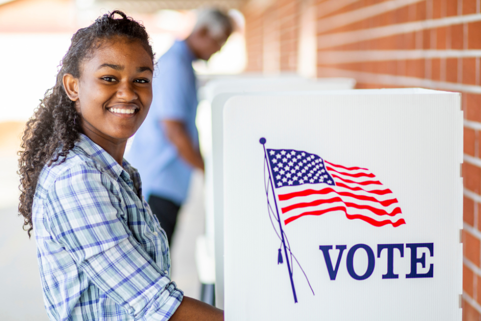 A young female at a polling location. Voting.