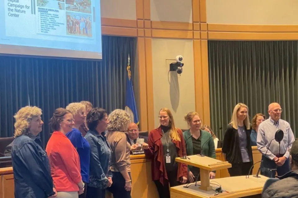 Friends of Oxbow presenting a check at the April 16, 2024, Olmsted County Board of Commissioners meeting.