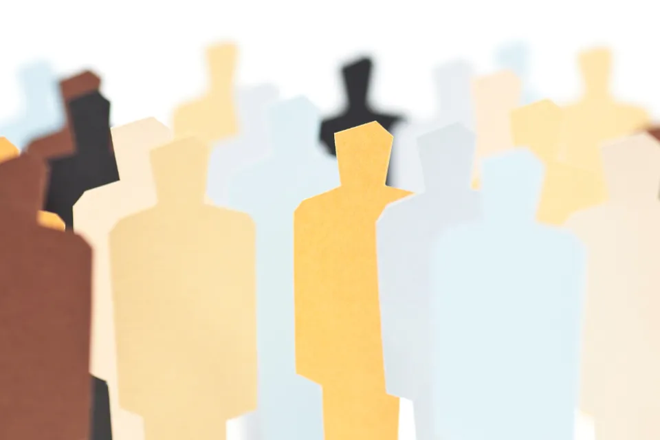 Colored images of paper cutouts that look like humans.