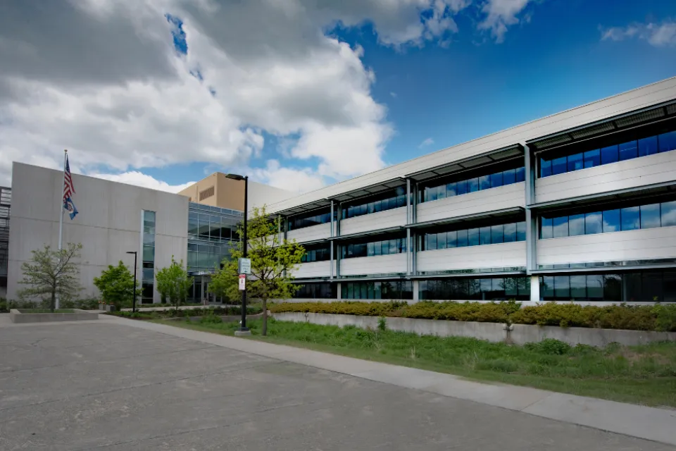 A picture of the 2117 building on a sunny day. Clouds in the sky.