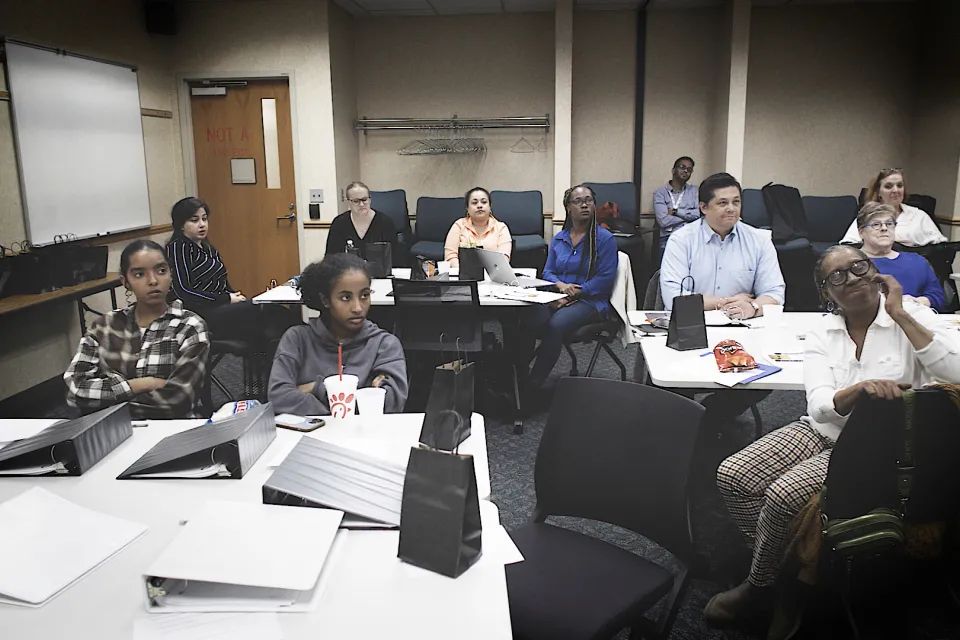 Community members in M.O.V.E. meeting