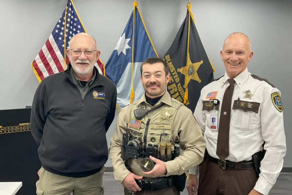 Deputy Jon Davis poses for a photo after receiving an award.