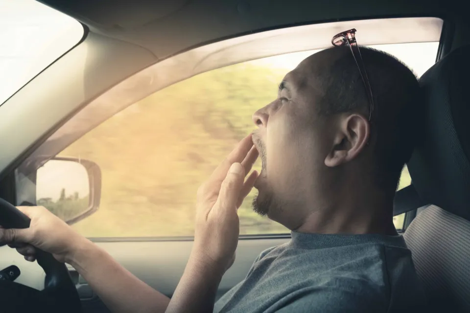 Driver behind the wheel who is tired