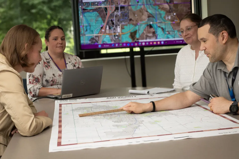 People huddled around a map
