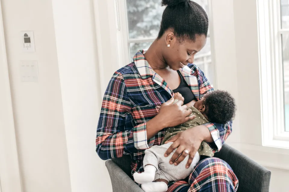 Woman breastfeeding an infant