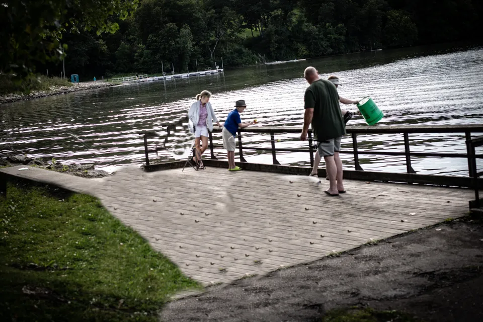 People on the fishing pier at Lake Zumbro Park