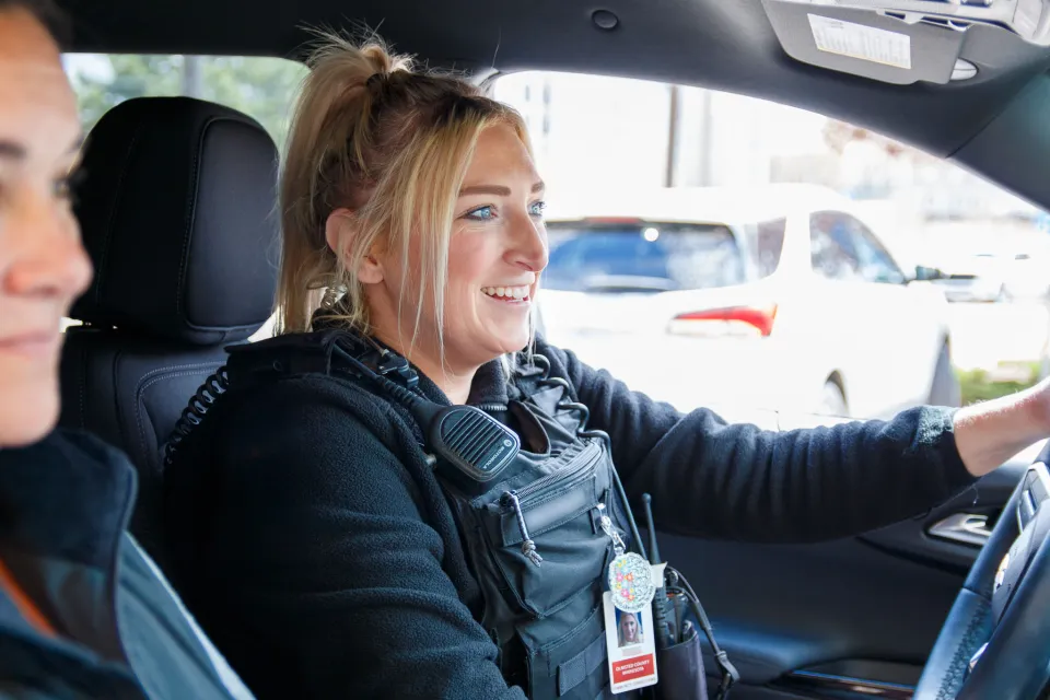 Crisis Response staff driving and conversing