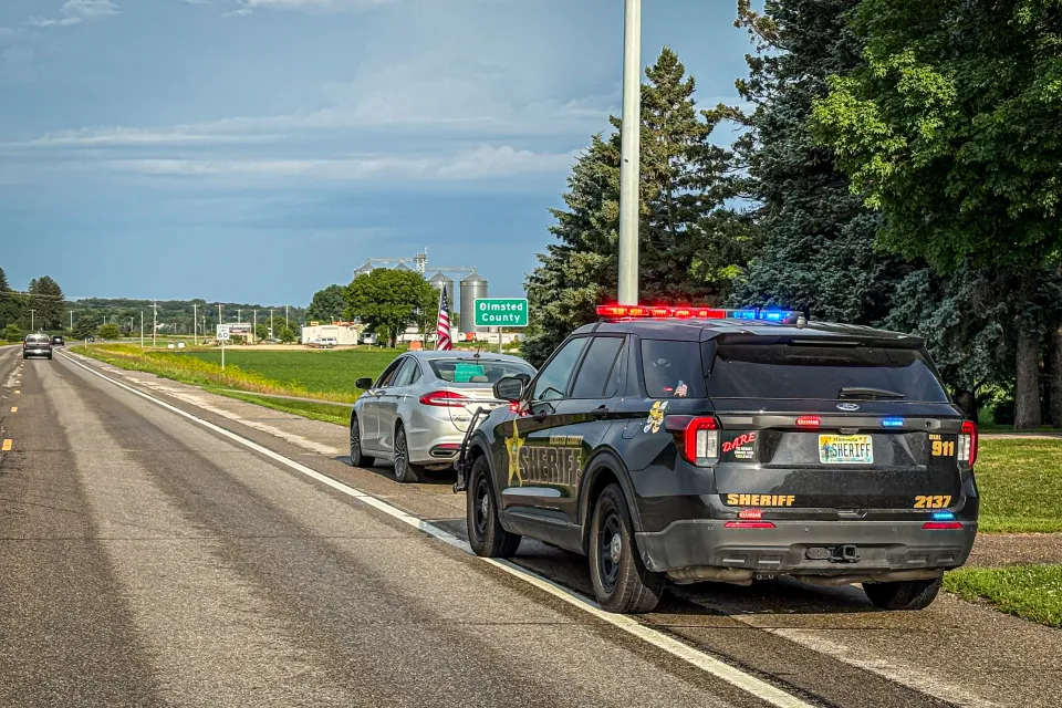 Olmsted County Sheriff's Office squad conducting a traffic stop on the side of the road.