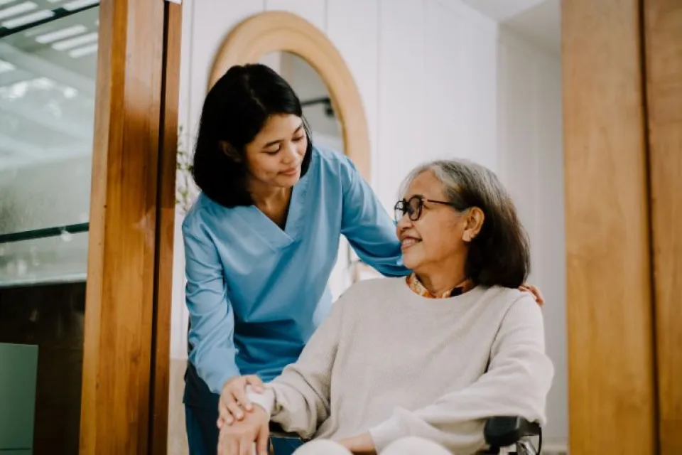 Elderly is getting assistance from a nurse