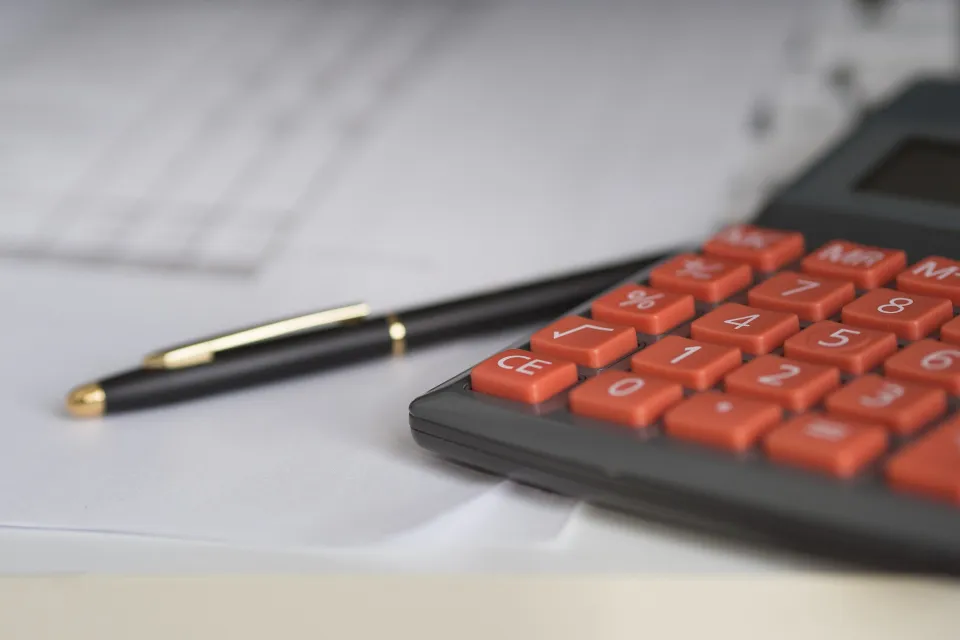 Closeup of calculator and pen